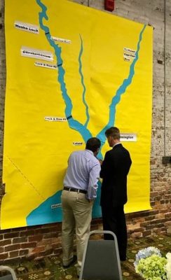 Wilmington boatwright Chris Sargent, left, and former Sen. Thom Goolsby share river stories while looking at a map of the Cape Fear during the event held Jan. 12-13. Photo: Rachael Goolsby