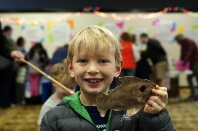 An unidentified community education day participant shows off his “catch.” Photo: Alan Cradick.