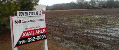 This 21-acre tract on N.C. 24 in Carteret County is being advertised as having sewer available. Photo: Frank Tursi, Coastal Review Online