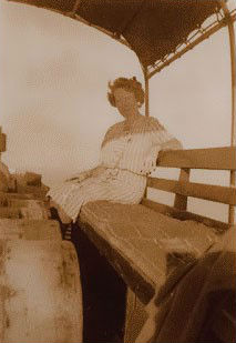 This photo, taken in the 1950s, shows that passengers shared space with cargo. This woman had no room to even stretch her leg because of the barrels on deck. Photo: Phillip Howard, Ocracoke Island Journal blog