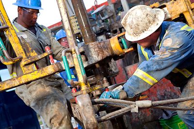 Roughnecks are the grunts of an oil platform workforce, which also includes scientists, accountants, cooks, welders, plumbers and a host of other skills. Photo: Oildrilling.com