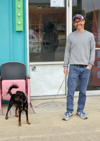 Wilmington native Dan Brawley with his dog Izzy in front of Jengo’s Playhouse. He says, “I think it’s absolutely outrageous, ridiculous—when you look at the fragile ecosystems that are disrupted by that type of activity it’s a no-brainer. We’re living in literally, right now, the greatest mass extinction that’s ever taken place on this planet, and it’s our fault.” Photo: Tess Malijenovsky