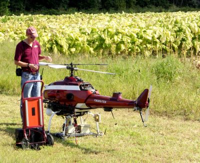 Pilot and mechanical engineer Kevin Kochersberger, an associate professor in the Virginia Tech College of Engineering, readies a 200-pound helicopter he engineered to fly autonomously to determine whether drones can gather data useful for managing crops. Photo: Virginia Tech