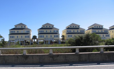 A row of homes occupy beside a bridge on New River Inlet Road where a temporary inlet opened up during storms in the 1990s. Photo: Mark Hibbs, Coastal Review Online