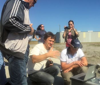 Russian environmental activists watch a demonstration of drones at North River Farms in Carteret County. Photo: N.C. Coastal Federation