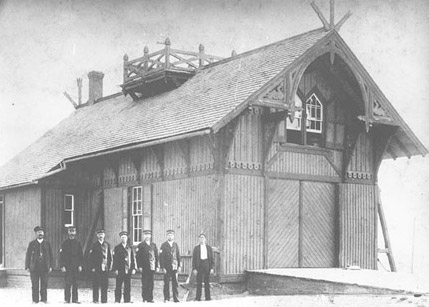 The Kitty Hawk Lifesaving Station and its crew around 1900. Photo: Library of Congress image enhanced by Joyner Library, East Carolina University.