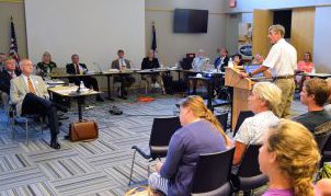 Mike Lopazanski of the Division of Coastal Management talk to the CRC about the sandbag rules. Photo: Mark Hibbs