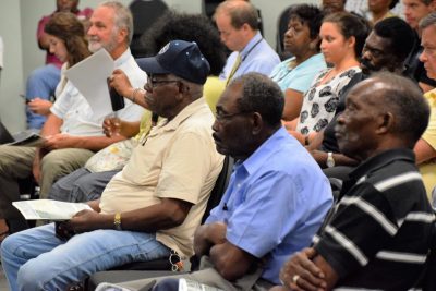 Townspeople listen as officials explain the what will happen over the next year. Photo: Mark Hibbs