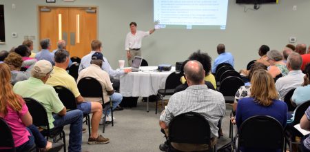 About 65 people attended a meeting Tuesday night to learn about the latest plans to clean up a Superfund site in Navassa. Photo: Mark Hibbs