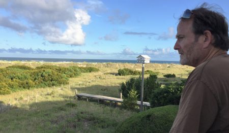 David Morrisette looks at the unspoiled land stretching from his family beach home on Figure Eight Island to the Atlantic Ocean. The terminal groin proposed to be built across the island’s northern end would be built through a portion of the family’s property. Morrisette said he and his siblings, whom own the home, will not willingly grant the private island’s homeowner’s association’s board of directors an easement to their property. Photo: Trista Talton