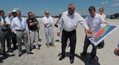 Rep. John Torbett, chair of a House long-range transportation planning committee, and Chris Gibson, a consultant for North Topsail Beach, review a map of inlet shoaling during the committee tour of the area. Photo: Kirk Ross