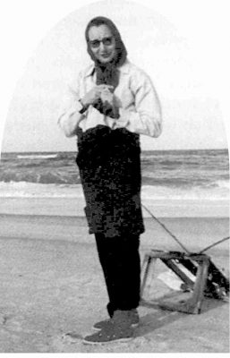 Nellie Myrtle Pridgen is shown doing what she spent much of her 74 years enjoying, scouting for beach glass, bottles, old toys and anything else of interest that washed up. Photo: Outer Banks Beachcomber Museum
