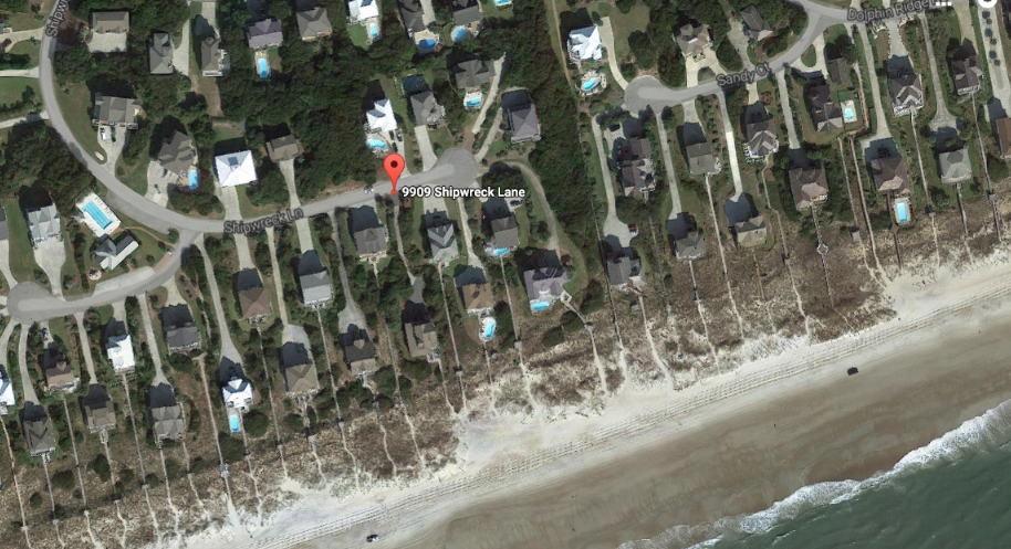Gregory and Diane Nies of 9909 Shipwreck Lane in Emerald Isle contend that the town's use of a 20-foot-wide driving lane across beach sand in front of their oceanfront home amounts to an unconstitutional taking of their private property. Photo: Google Earth