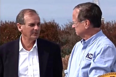 Malcolm Fearing and Nick Tennyson speak during a recent update on Bonner Bridge construction. Photo: Michael Beswick