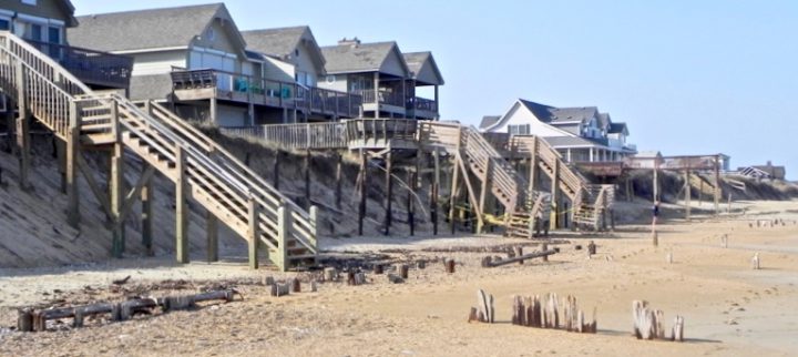 Old pilings and debris on the beach at Pelican Watch. Photo: Rob Morris