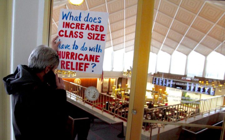 With galleries locked after disruptions, Jim Igoe of Durham stands outside listening to the state House session on his phone. A last minute proposal to increase class sizes was not approved. Photo: Kirk Ross